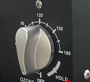 Cận cảnh núm hẹn giờ với các mốc 90, 120, 150, 180 phút, vị trí OFF và HOLD